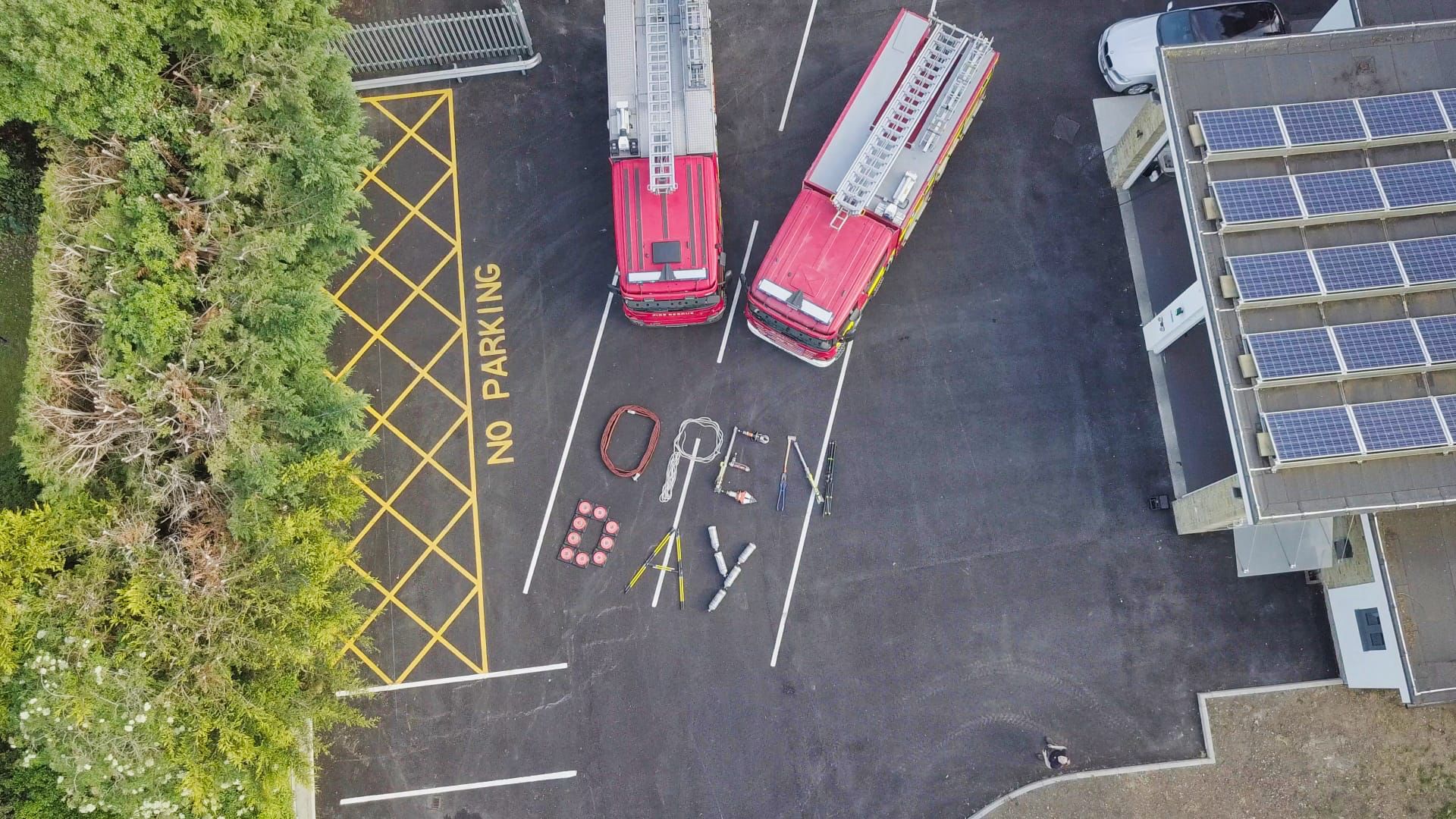 An aerial shot of two fire engines and the words "Open Day"