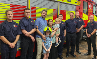 Firefiighters from Loughton Blue Watch with Draper family