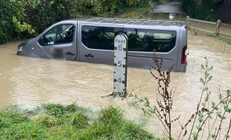 A people carrier stuck in a flooded road in Clavering