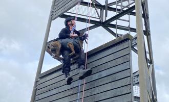 Essex Police officer and police dog on a harness