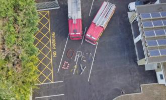 An aerial shot of two fire engines and the words "Open Day"