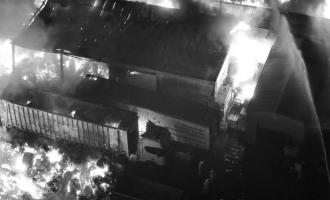 A drone image of a warehouse on fire