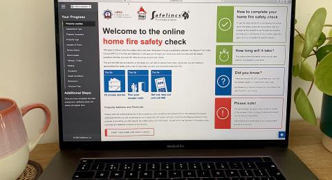 A laptop with the online home fire safety check page open