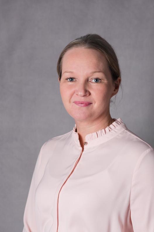 Head and shoulders photo of Colette Black our Director of People Services. She is wearing a pink shirt and has her hair tied back.