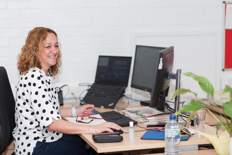 Call centre handler at her desk