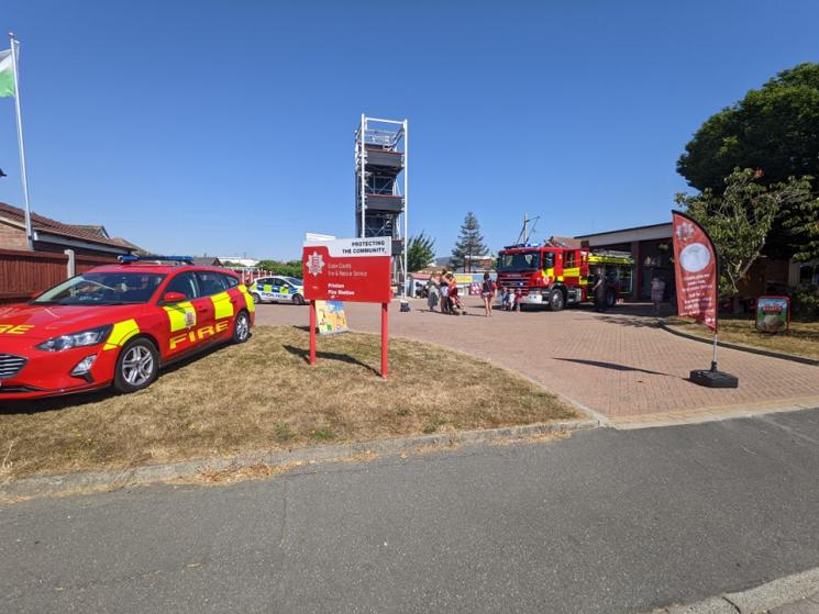 Frinton Fire Station, blue skies, fire car parked outside