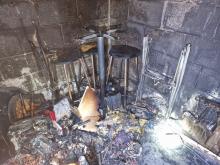 The inside of a burnt out outbuilding