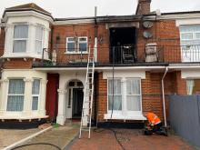 Terraced house with burnt out window