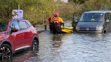 A car and a van stuck in flood water