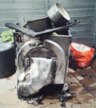 A burnt-out tumble dryer