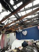 A roof destroyed by fire after a lightning strike