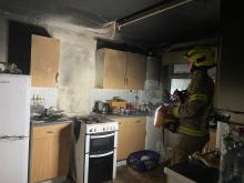 A smoke damaged kitchen following a hob fire