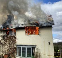 A thatched roof fire