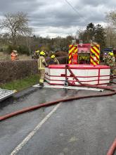 Firefighters using a Water Bowser to shuttle water at a fire